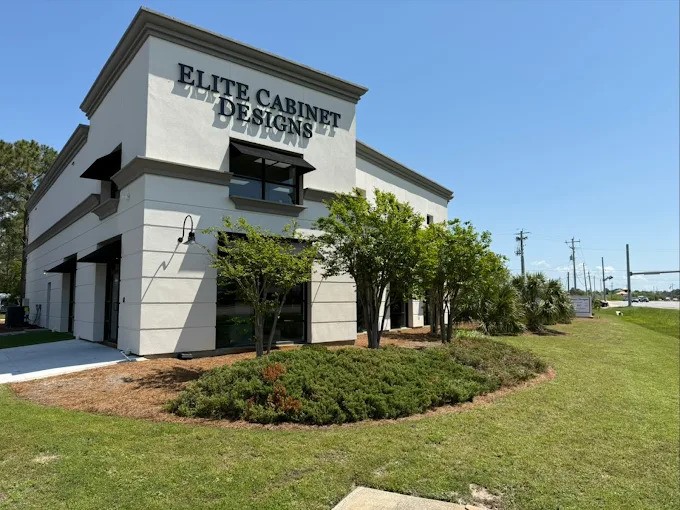 Elite Cabinet Designs Store Elite Cabinet Designs storefront with modern architecture, featuring signage, landscaped greenery, and clear blue sky, located in North Florida.